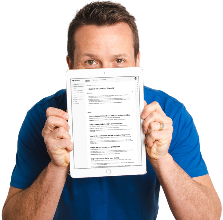 David Jenyns holding an iPad showing the System for Creating Systems in systemHUB
